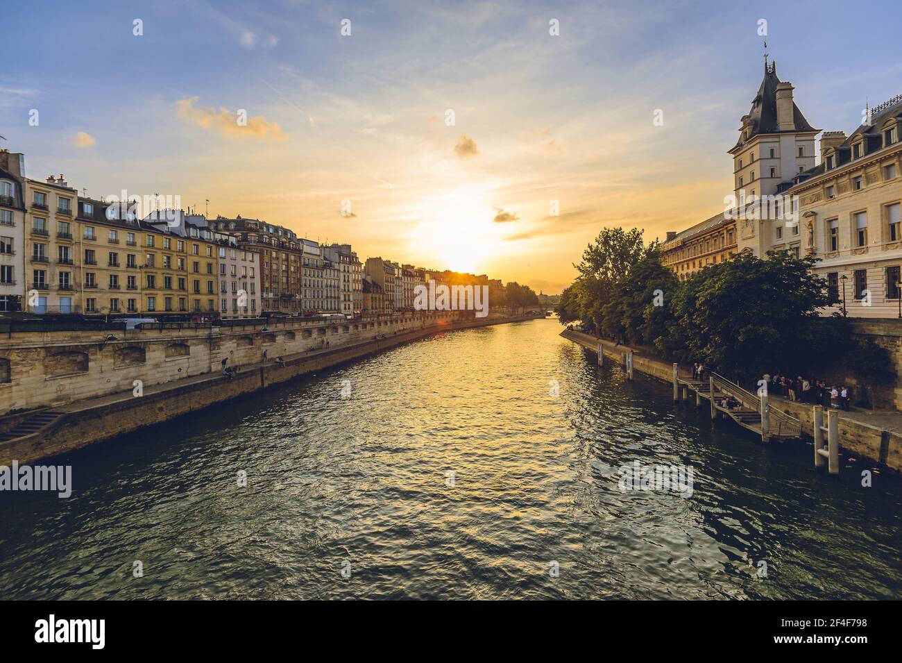 Court of Cassation of france in paris and left bank of seine river at dusk Stock Photo