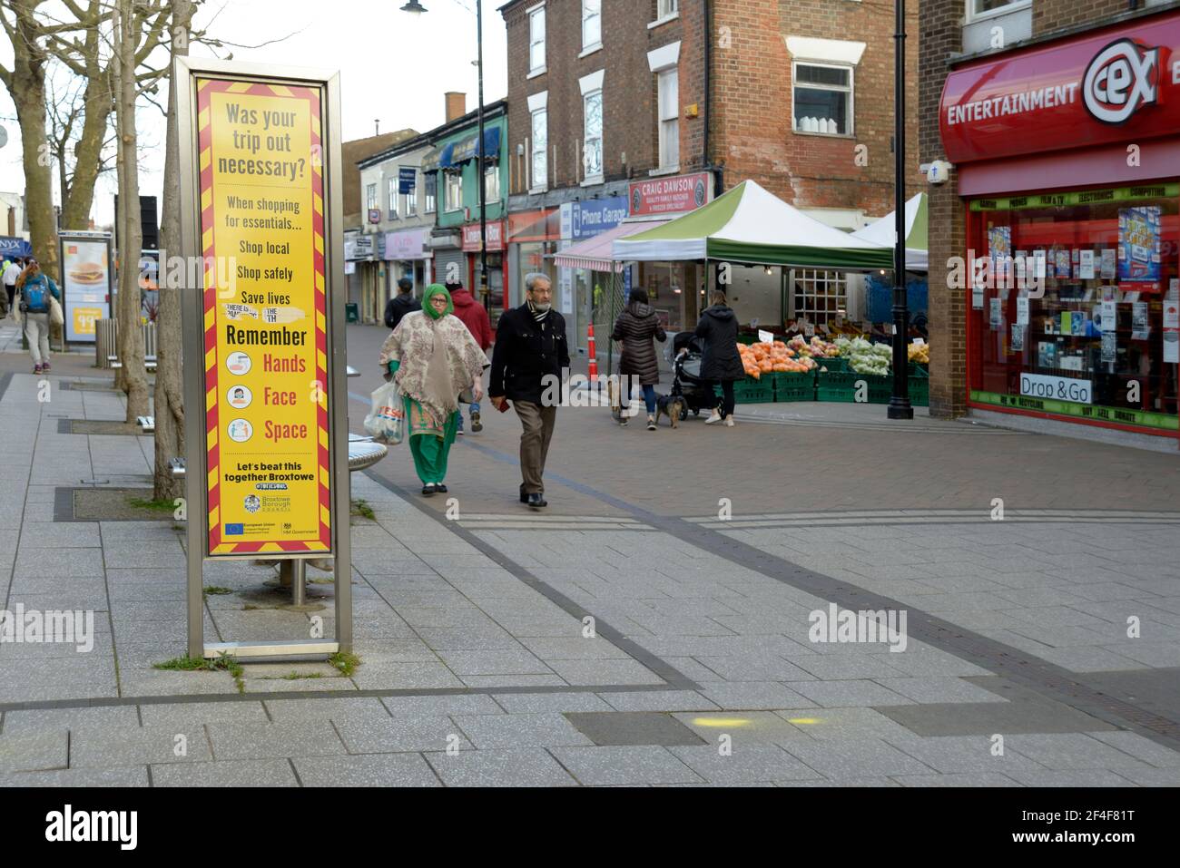 Corona Virus warning sign on pedestrian street Stock Photo - Alamy