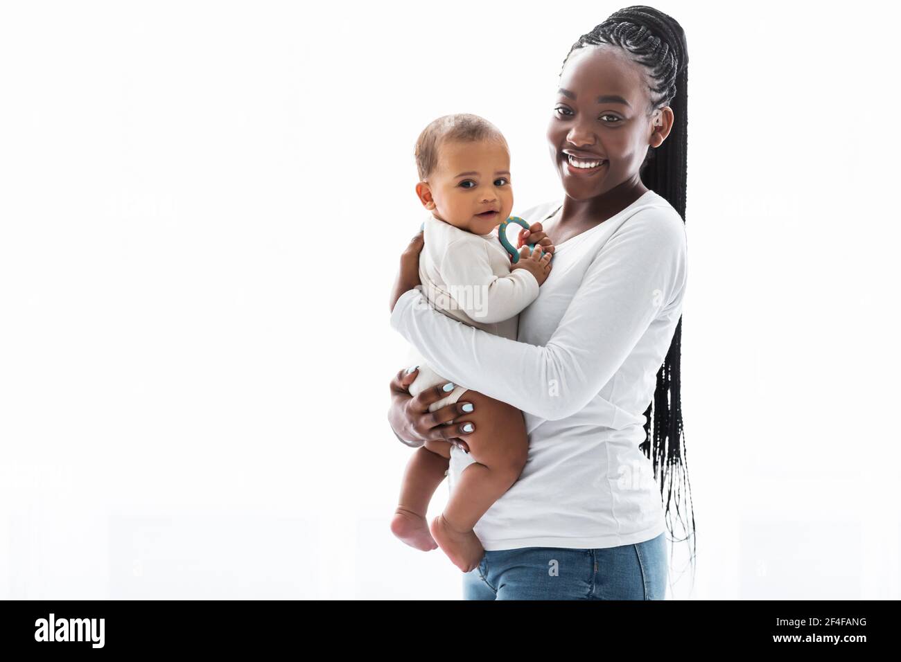 African American mom hugging her cute infant Stock Photo