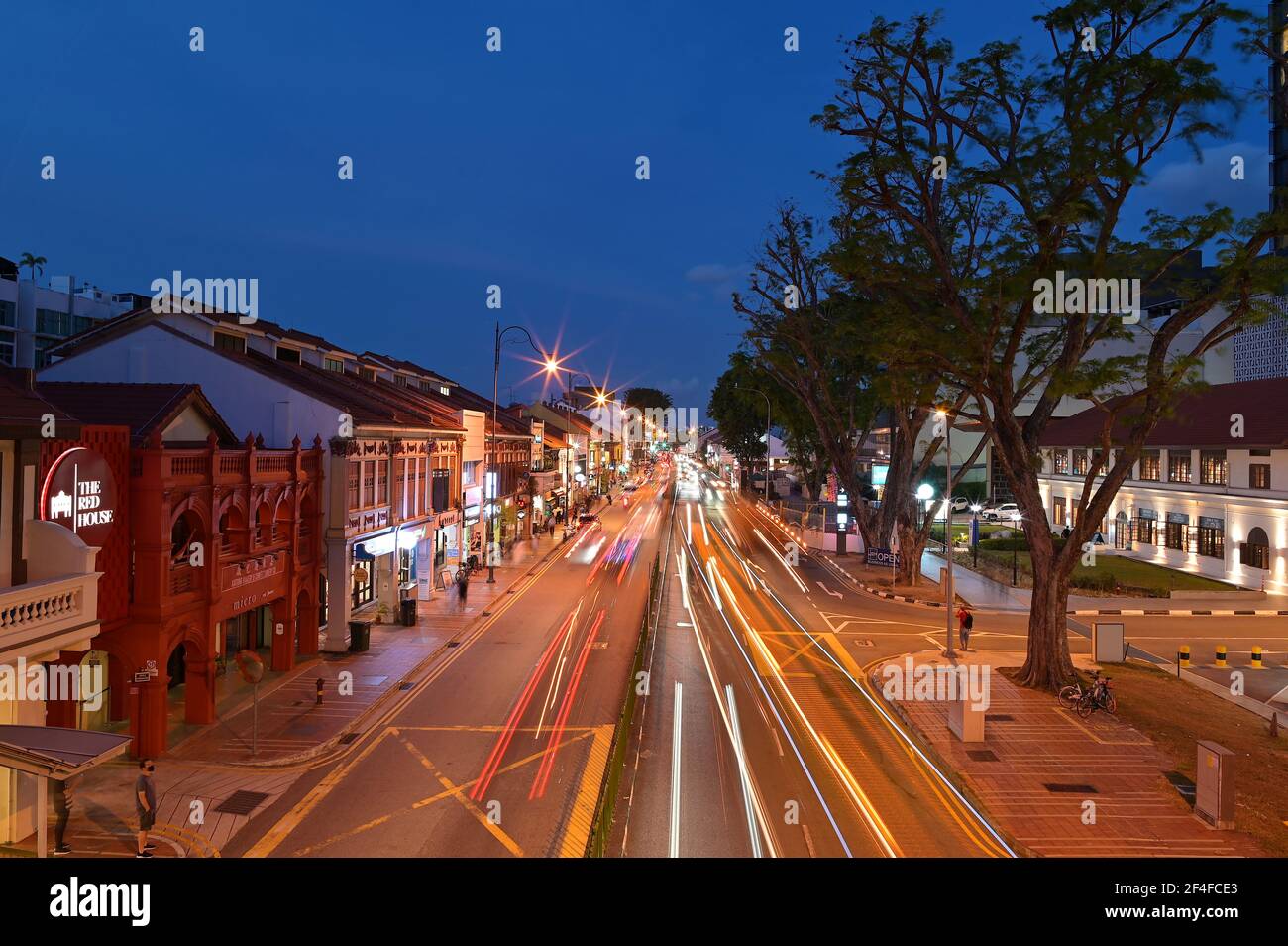 Evening traffic, East Coast Road, Katong, Singapore: a bustling neighborhood, known for its colorful heritage houses & eclectic mix of pubs & eateries Stock Photo