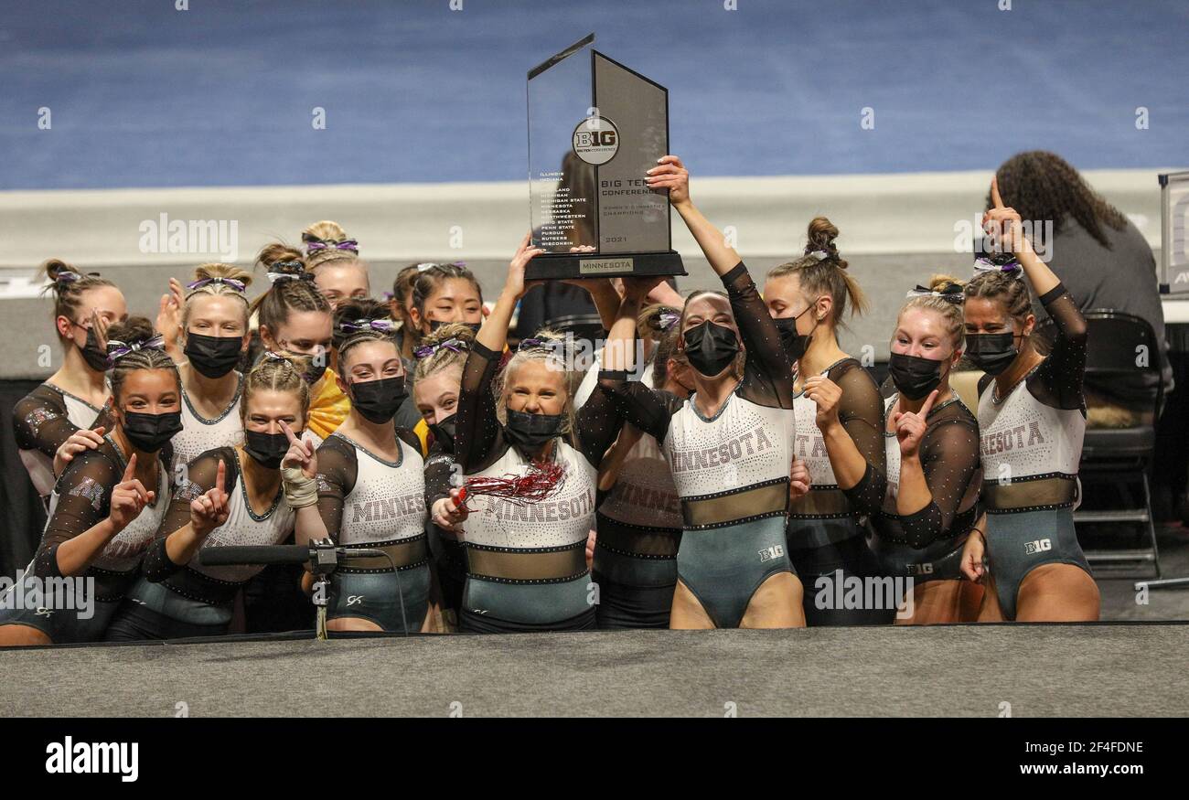 The Minnesota women's gymnastics team raises the Big 10 championship