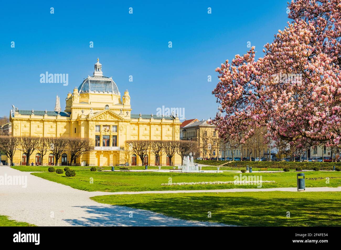 Colorful magnolia blossom and art pavilion in spring in Zagreb, Croatia Stock Photo