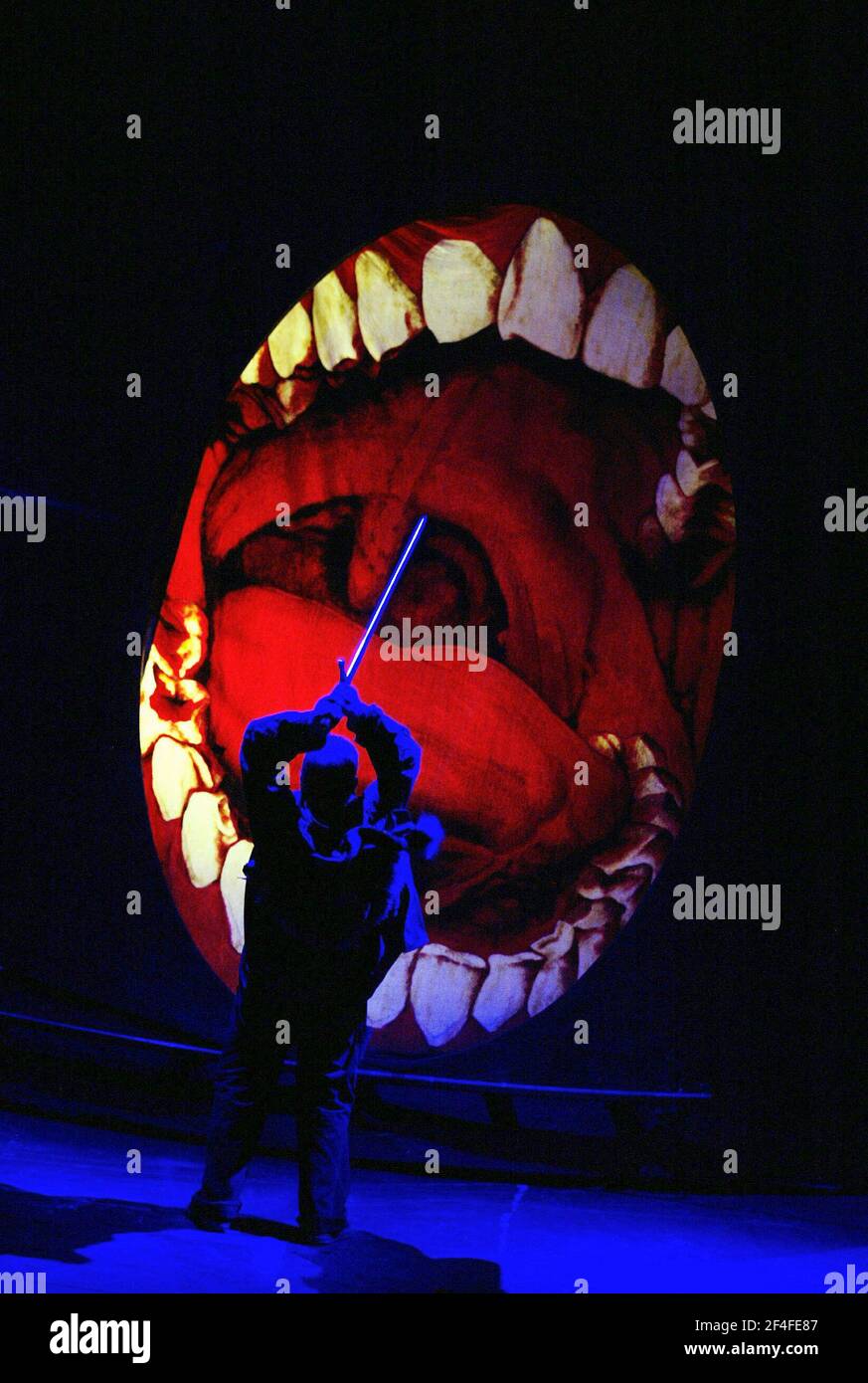 Siegfried kills the dragon (Fafner in disguise): Graham Sanders (Siegfried) in SIEGFRIED by Wagner at the Edinburgh International Festival  14/08/2003  a Scottish Opera production  conductor: Richard Armstrong  set design: Hildegard Bechtler  costumes: Ana Jebens  lighting: Peter Mumford  director: Tim Albery Stock Photo