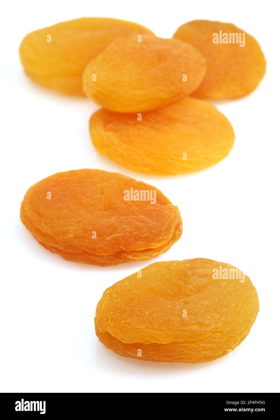 Dried apricot (Prunus armeniaca), dried fruit against white background