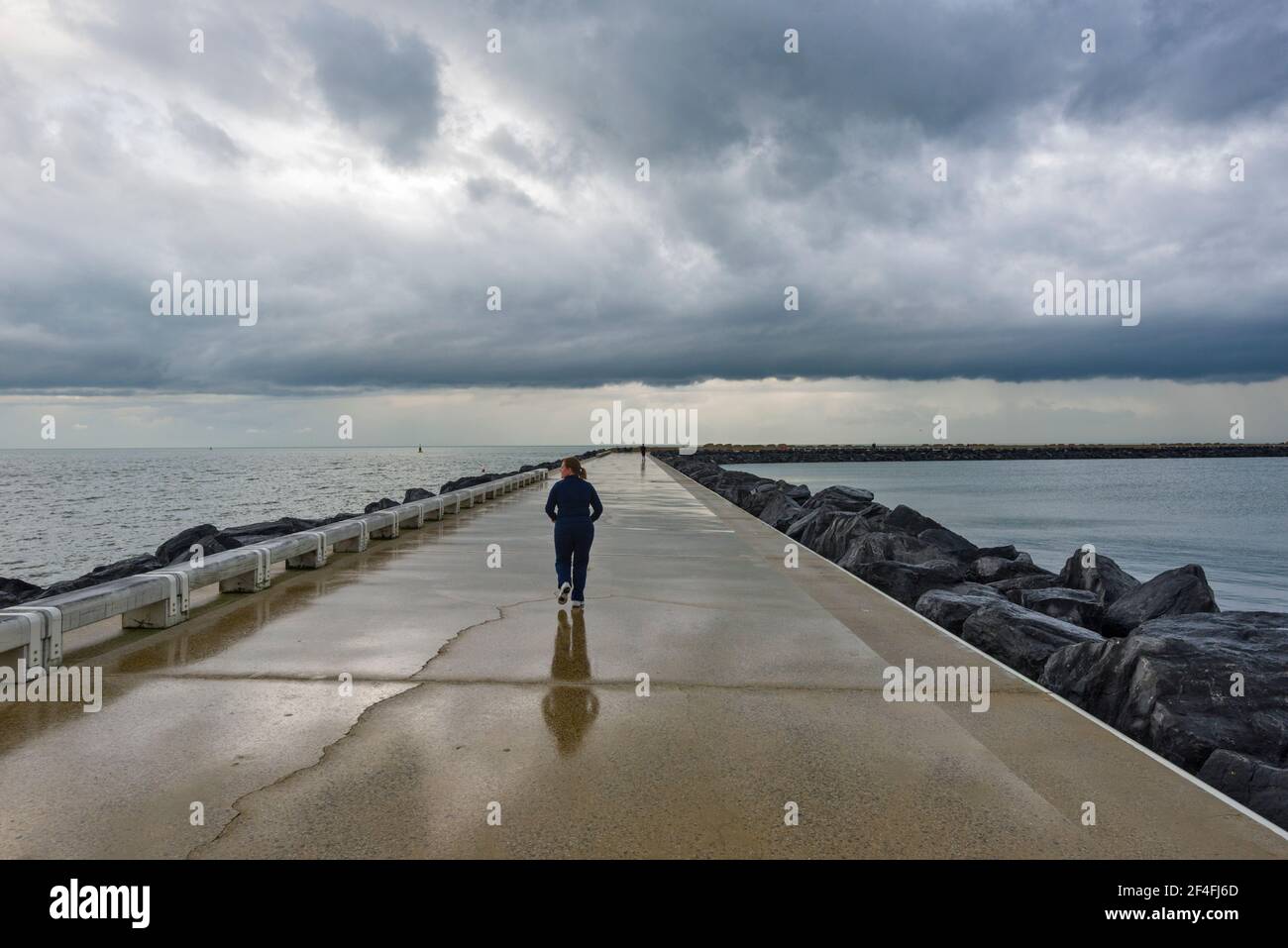 pier and stormy sky in Ostend, Belgium Stock Photo