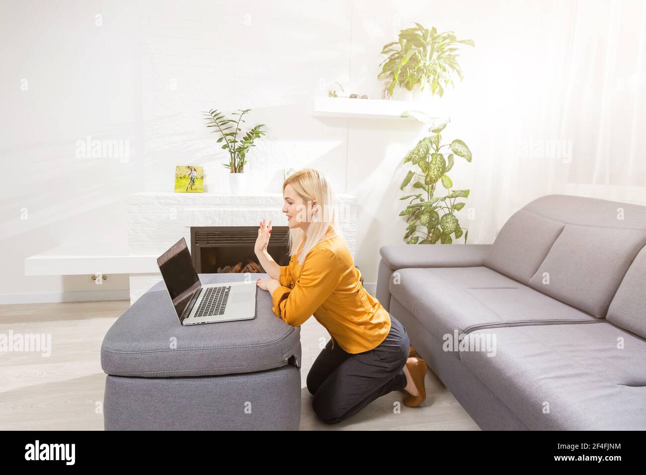 Beautiful young woman working on her laptop at home Stock Photo - Alamy