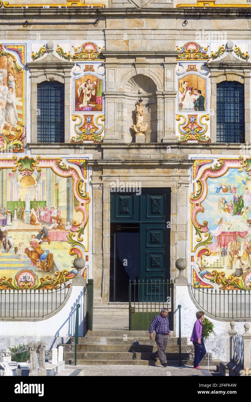 facade covered with azulejos of the Nossa Senhora do Amparo Church located in Valega, district of Aveiro, Portugal Stock Photo