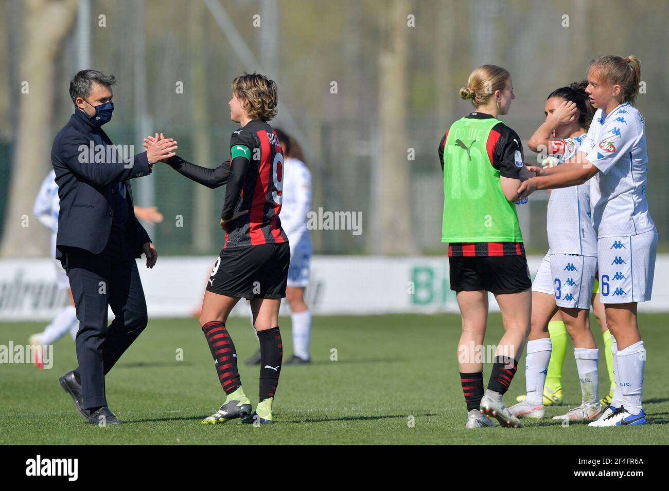 Milan, Italy. 21st Mar, 2021. Greetings between Head Coach Empoli Alessandro Spugna and Valentina Giacinti (#9 AC Milan) during the women Serie A match between AC Milan and Empoli at Vismara Sports Center in Milan, Italy Credit: SPP Sport Press Photo. /Alamy Live News Stock Photo
