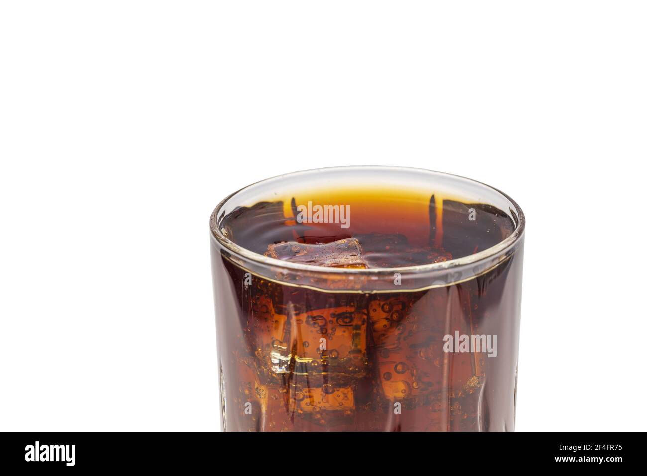 Close up view of top of full glass of soda with ice cubes isolated