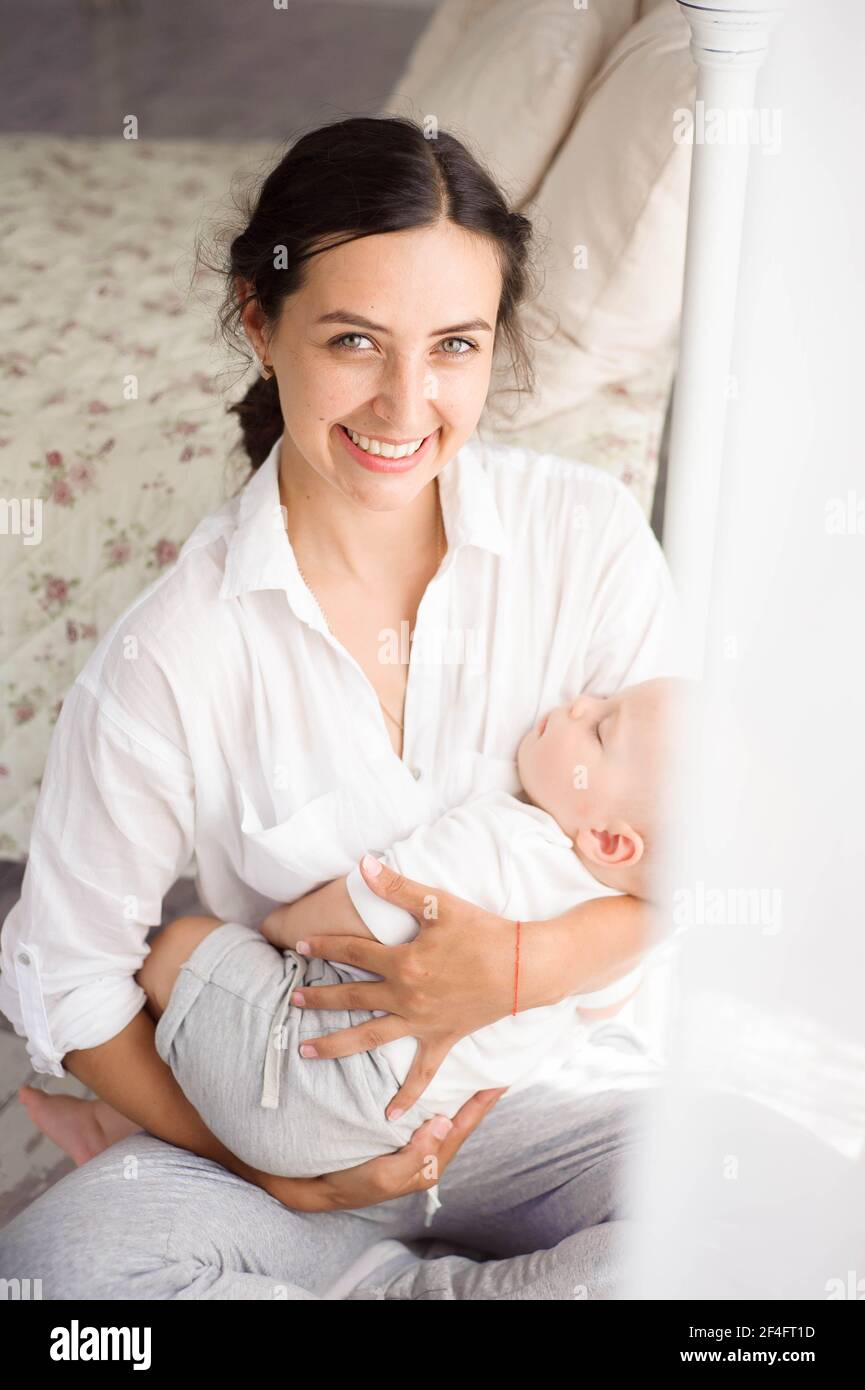 Baby sleeping on mom chest hires stock photography and images Alamy
