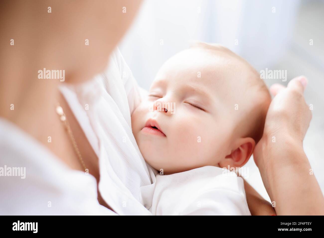 Baby sleeping on mom chest hires stock photography and images Alamy