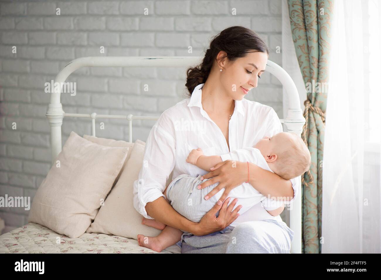 Baby sleeping on mom chest hires stock photography and images Alamy