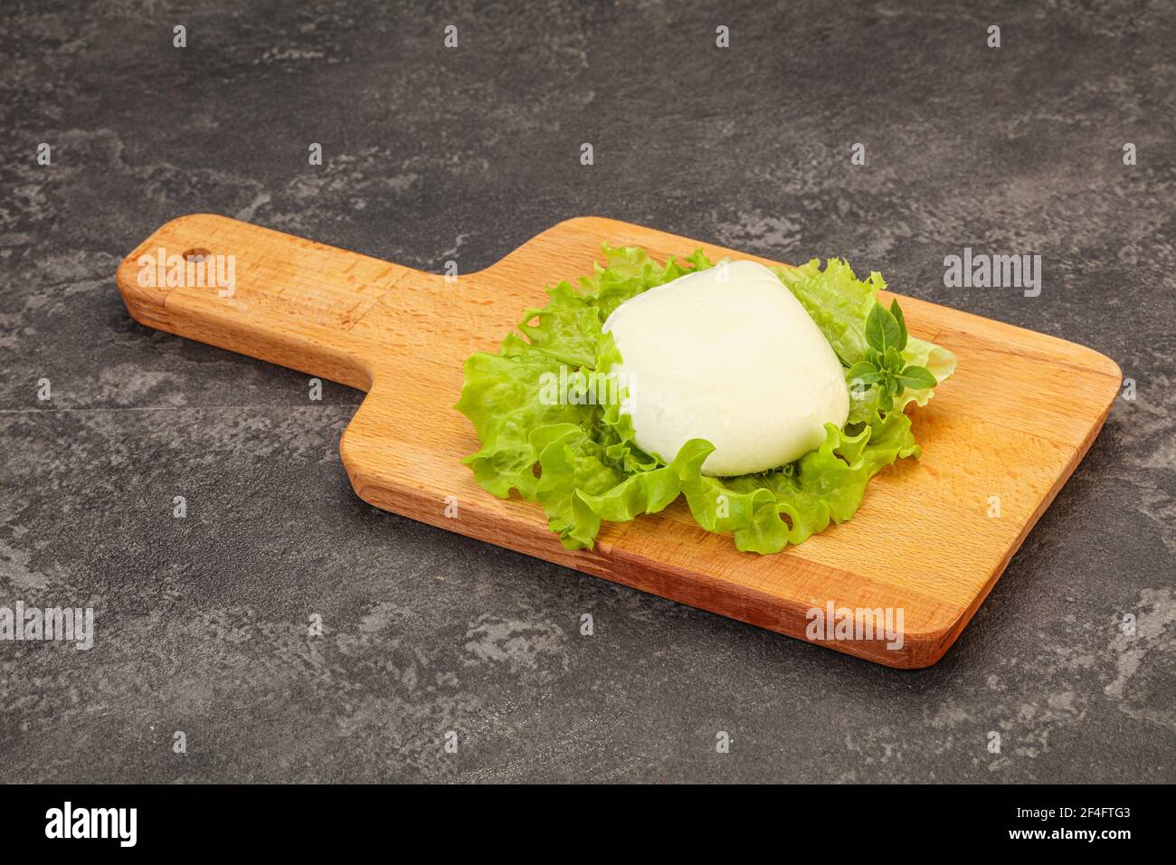 Italian Mozzarella cheese ball over board Stock Photo Alamy
