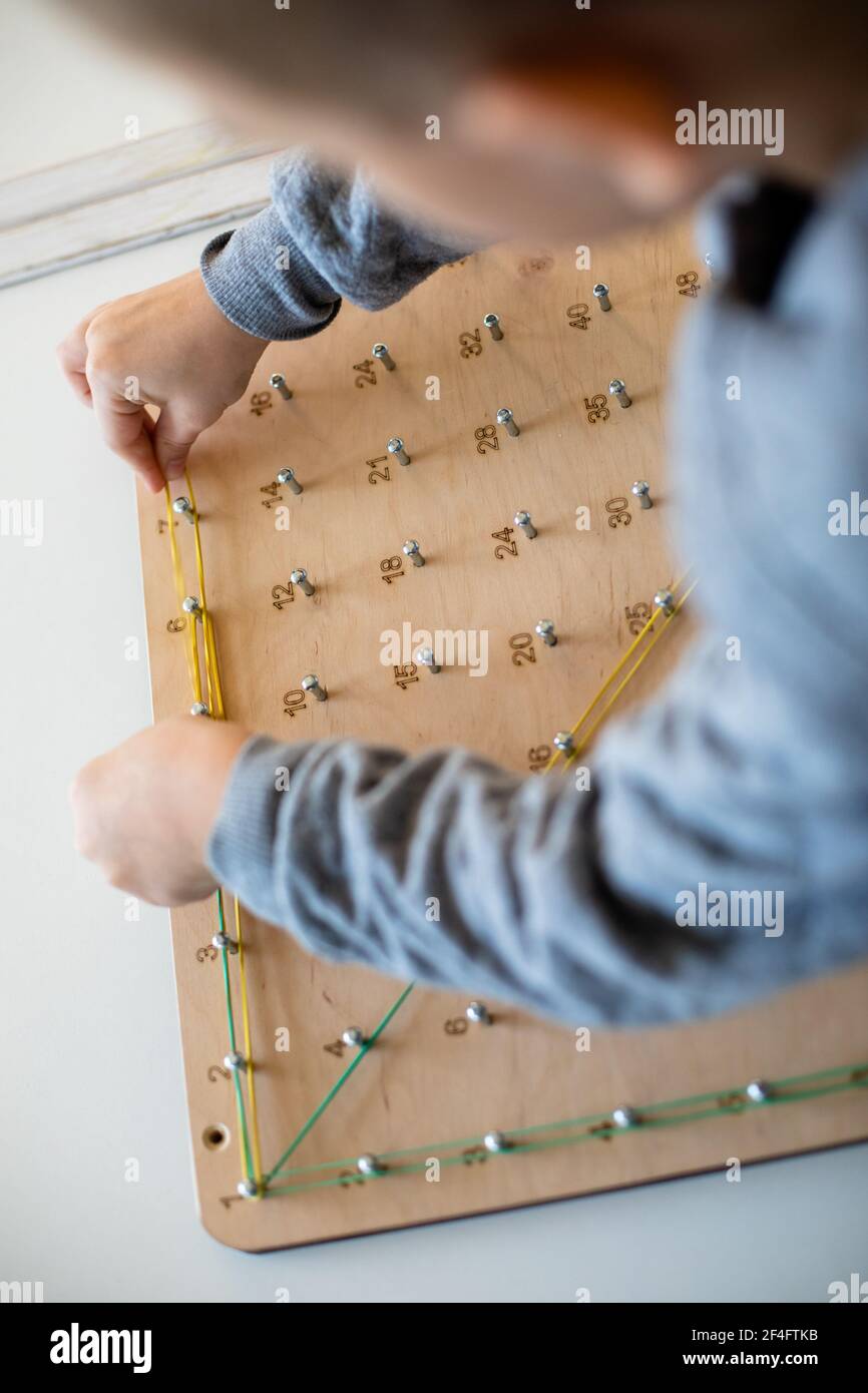 Exploring basic math and geometry concepts with geoboard Stock Photo ...