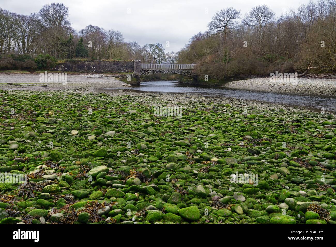 Aber-Ogwen Bridge is at the mouth of the River Ogwen in the Menai Straits. This cast iron bridge was built in 1821 at the Penydarren Ironworks. Stock Photo