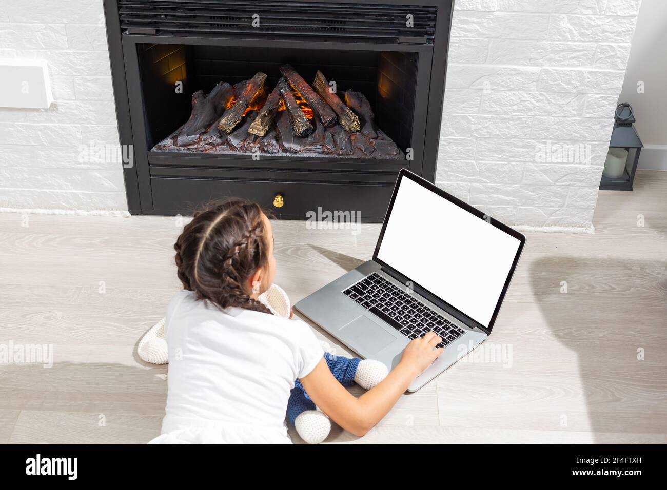 Kids distance learning. Cute little girl using laptop at home ...
