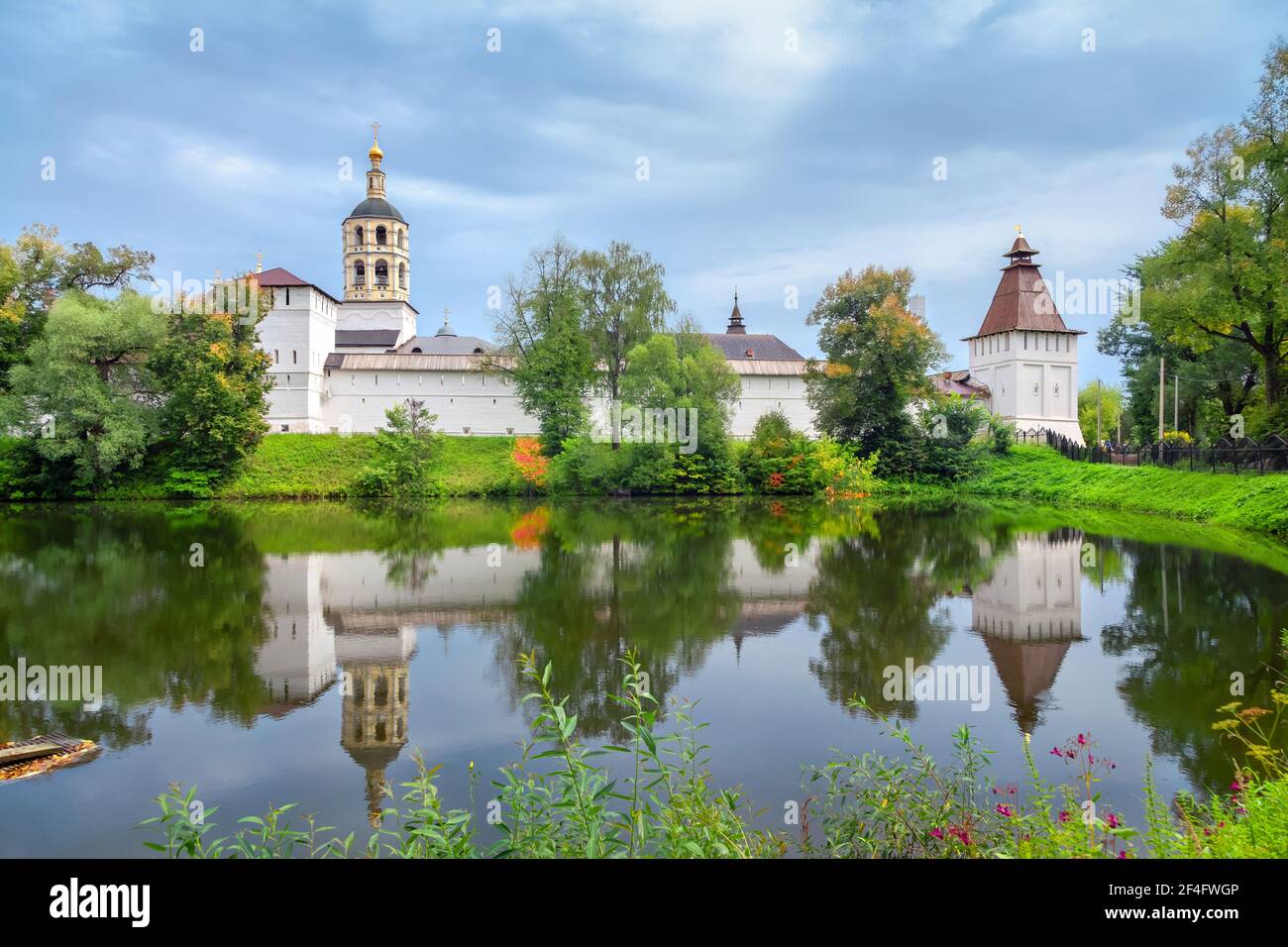St. Paphnutius of Borovsk Monastery reflecting in water, Kaluga oblast, Russia Stock Photo