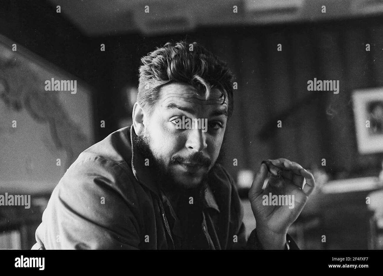 Portrait of revolutionary leader Comandante Ernesto Che Guevara, aka 'Che Guevara', in his office, Cuba, 1963. From the Deena Stryker photographs collection. () Stock Photo