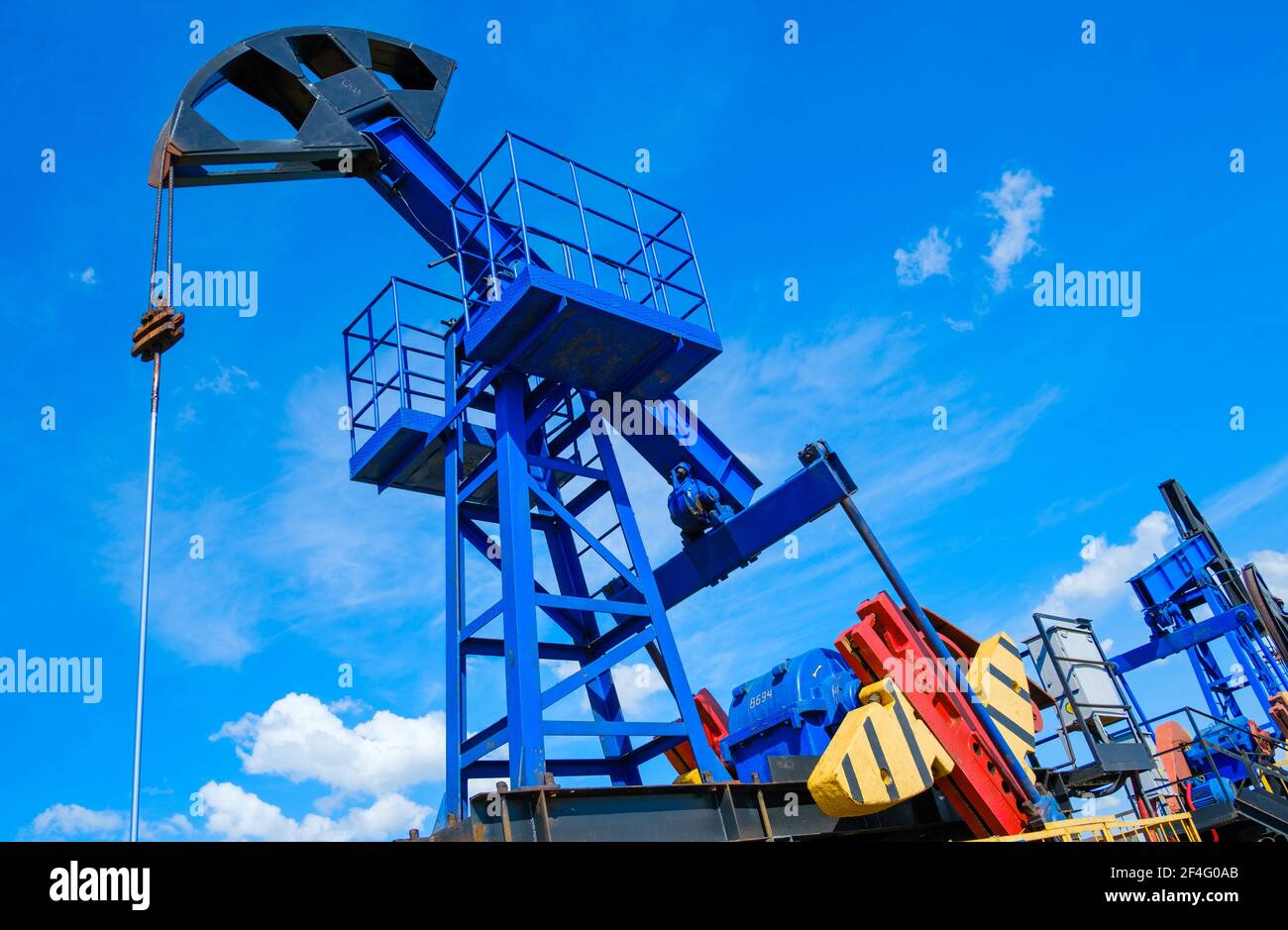 Oil pumps against cloudy sky Stock Photo Alamy