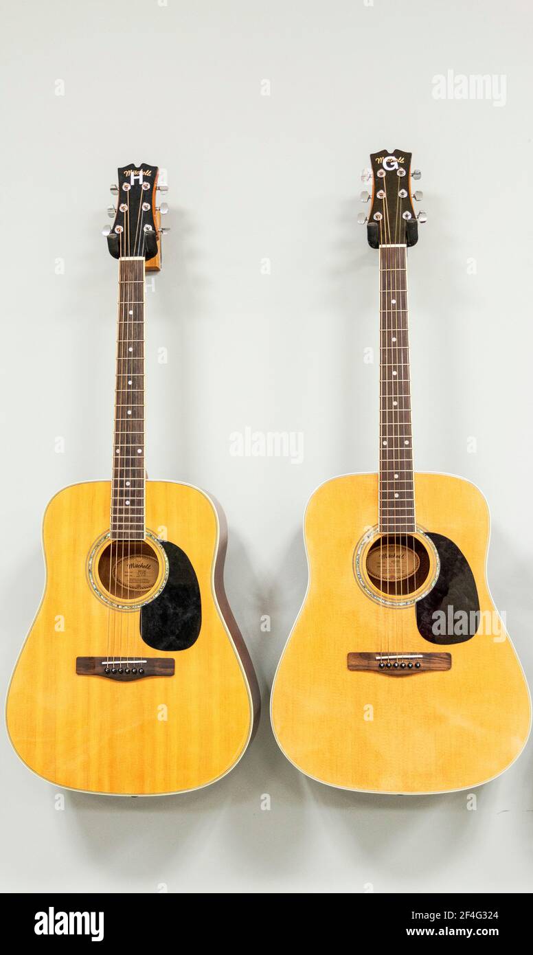 West Islip, New York, USA 30 November 2018 Two guitars hanging next
