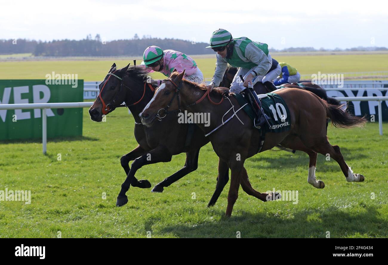 Amazed By Grace ridden by Danny Sheehy (left) beats True Artist ridden by Niall McCullagh to win the Paddy Power Madrid Handicap at Curragh Racecourse. Picture date: Sunday March 21, 2021. Stock Photo