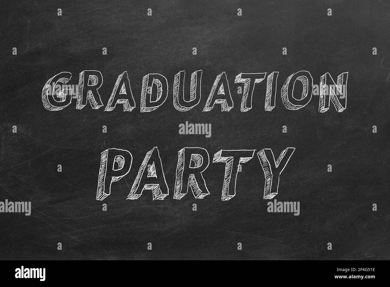 Hand drawing  text 'Graduation party' on blackboard Stock Photo