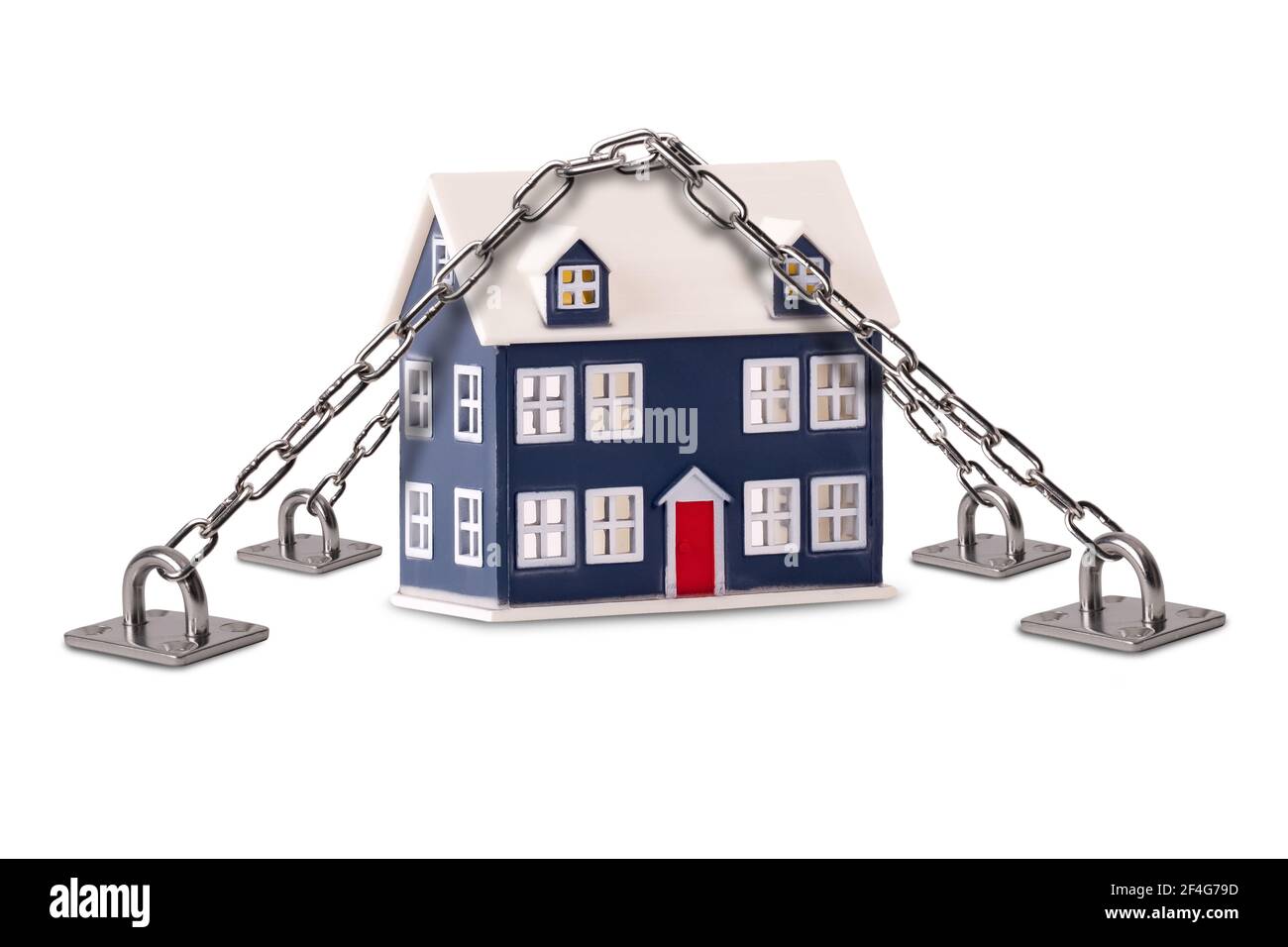 Secure house and building insurance concept. Home security protection with a tiny house chained and locked down on a isolated white background Stock Photo