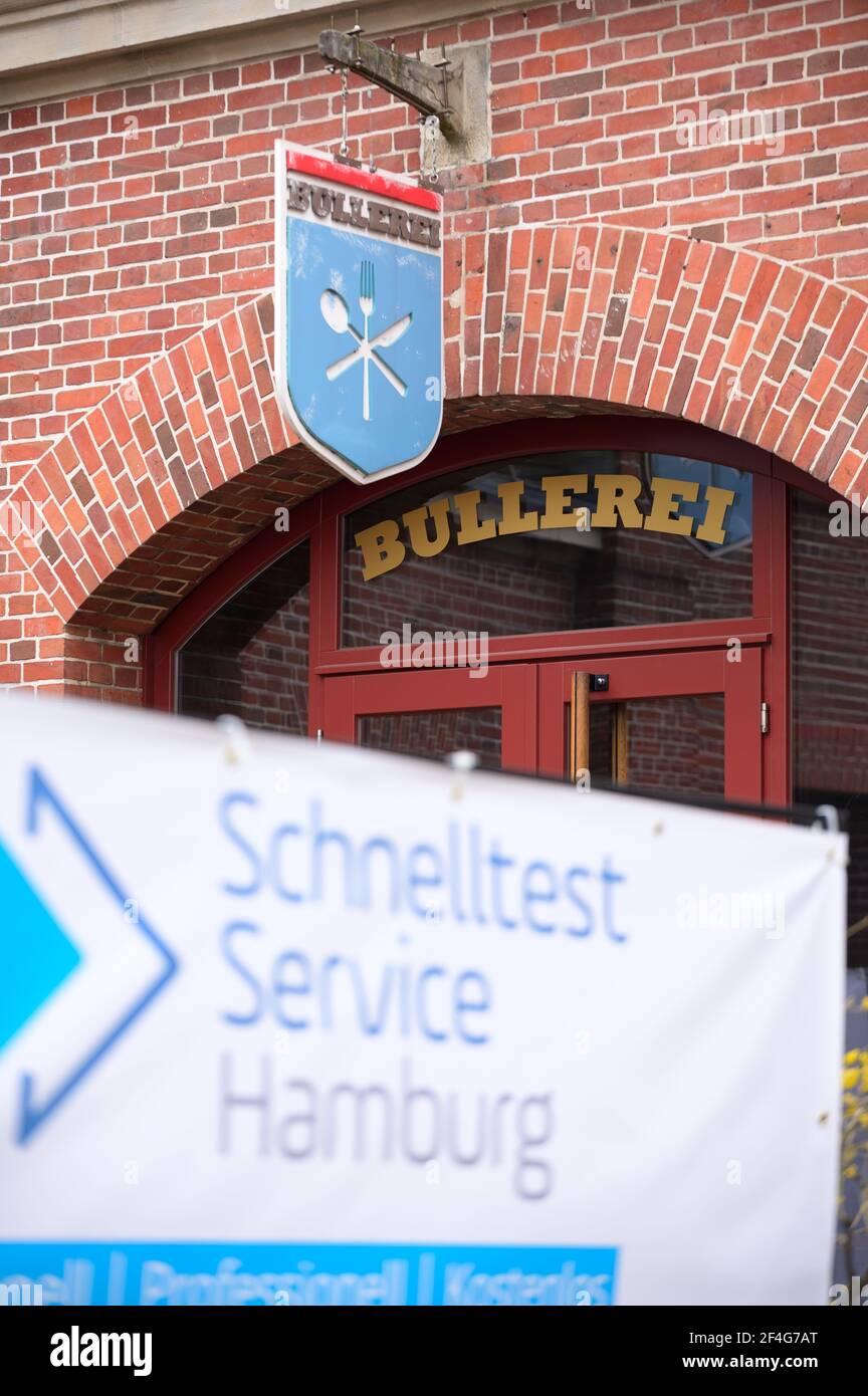 Hamburg, Germany. 18th Mar, 2021. A poster with the inscription 'Schnelltest Service Hamburg' stands in front of the 'Bullerei'. In the restaurant 'Bullerei' of the Hamburg restaurateur and TV chef Mälzer, Hamburgers can get tested for the corona virus free of charge. Credit: Jonas Walzberg/dpa/Alamy Live News Stock Photo