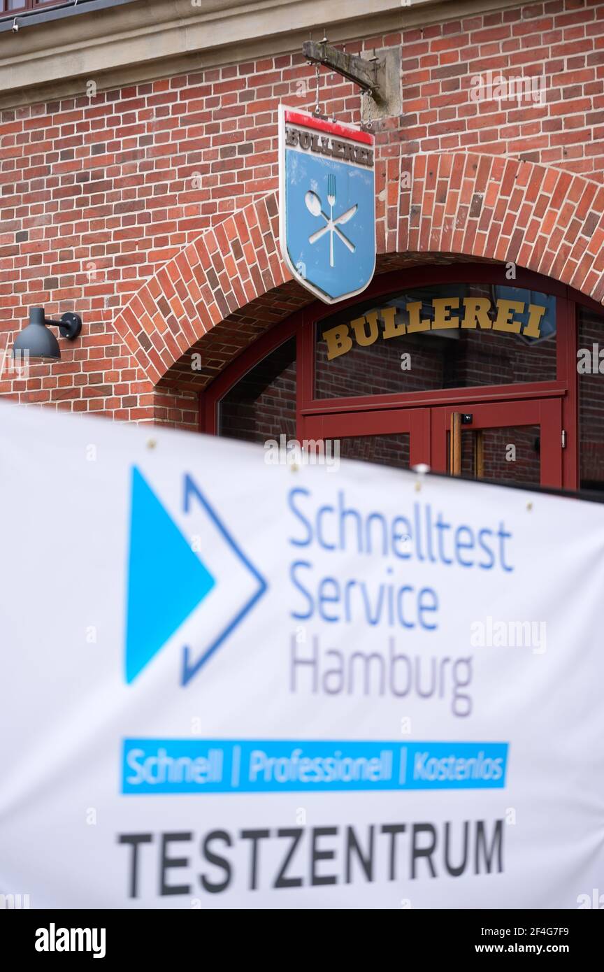Hamburg, Germany. 18th Mar, 2021. A poster with the inscription 'Schnelltest Service Hamburg Testzentrum' stands in front of the 'Bullerei'. In the restaurant 'Bullerei' of the Hamburg restaurateur and TV chef Mälzer, Hamburgers can get tested for the corona virus free of charge. Credit: Jonas Walzberg/dpa/Alamy Live News Stock Photo