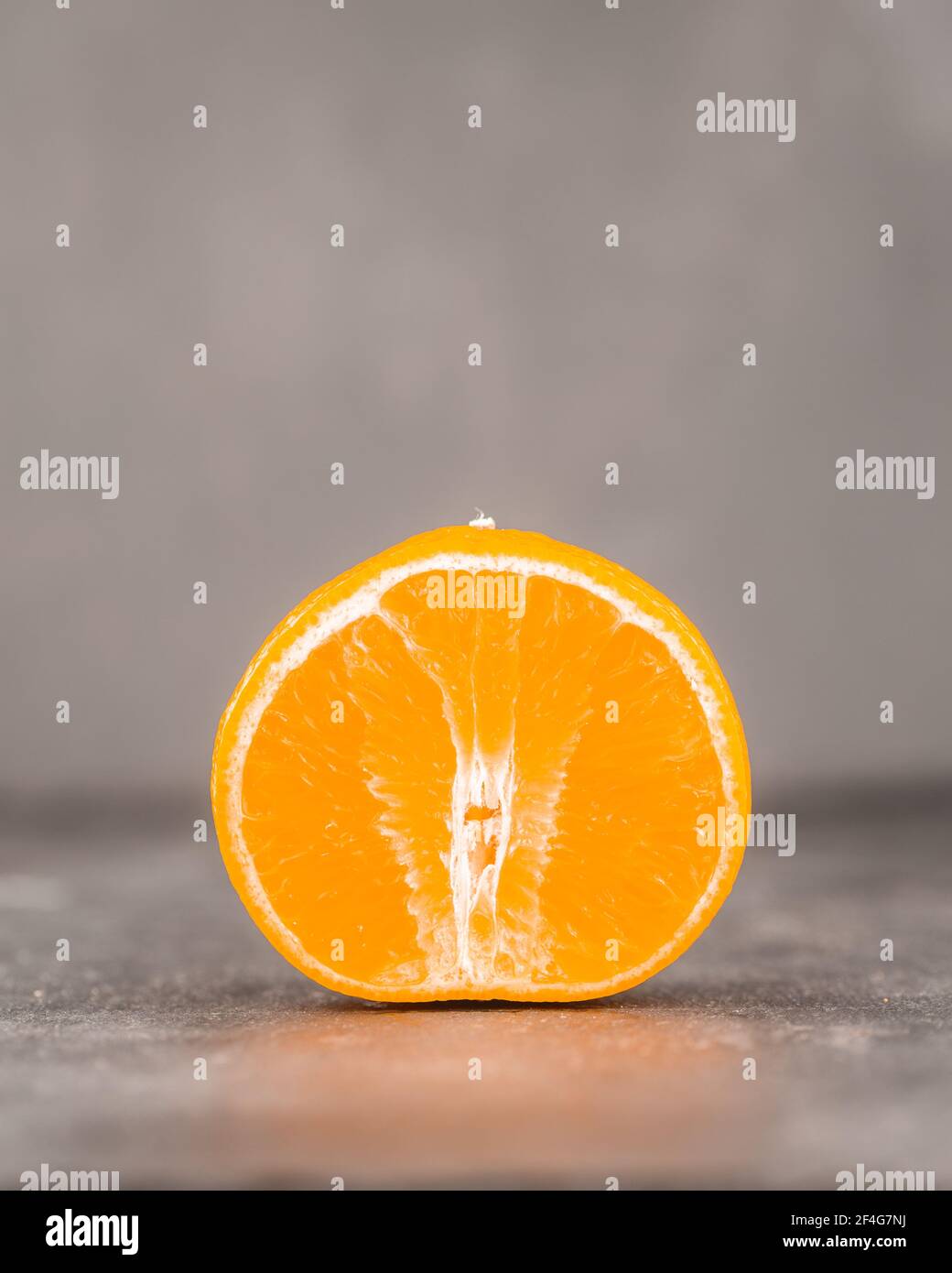 Tangerine cut in half Stock Photo