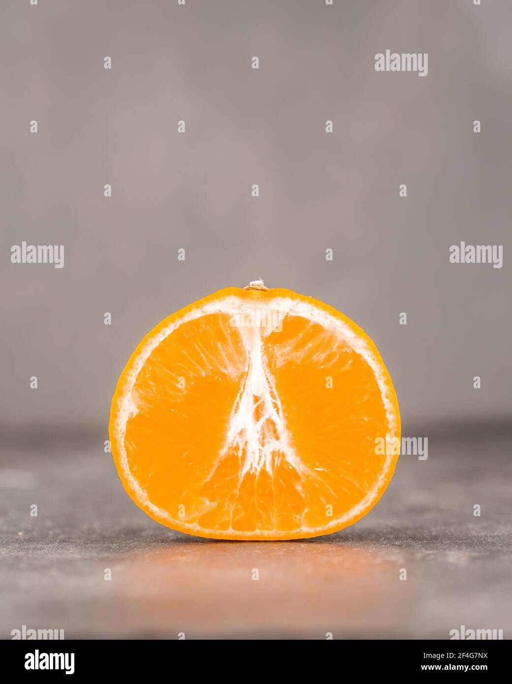 Tangerine cut in half Stock Photo Alamy