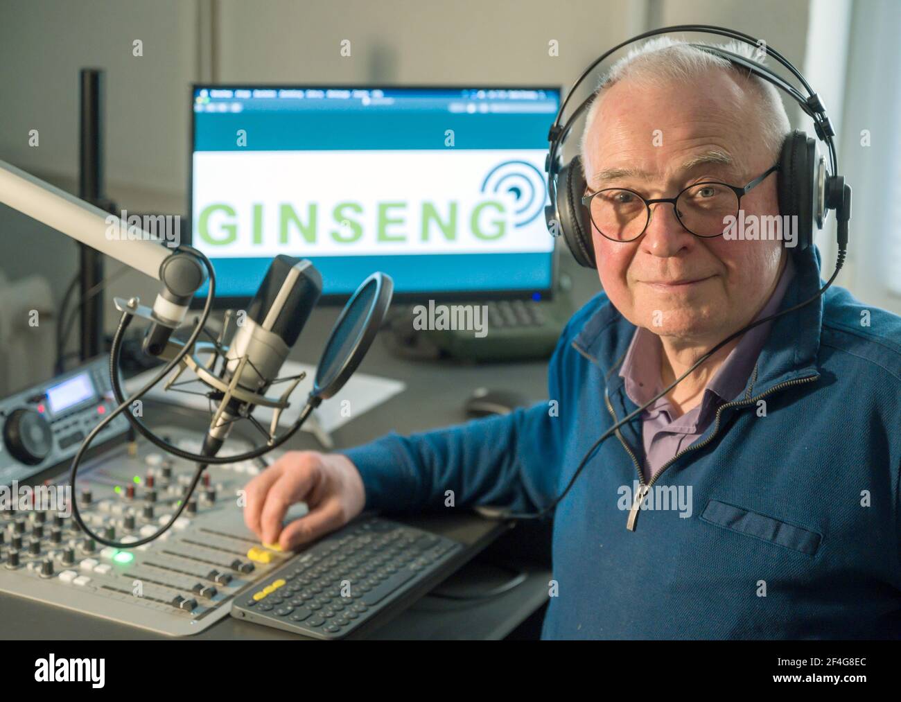 17 March 2021, Brandenburg, Grünheide: Ulrich Burow, chairman of the Radio  Ginseng e.V. association, sits in the broadcasting studio. Senior citizens  are now making radio in Grünheide. At the end of March,