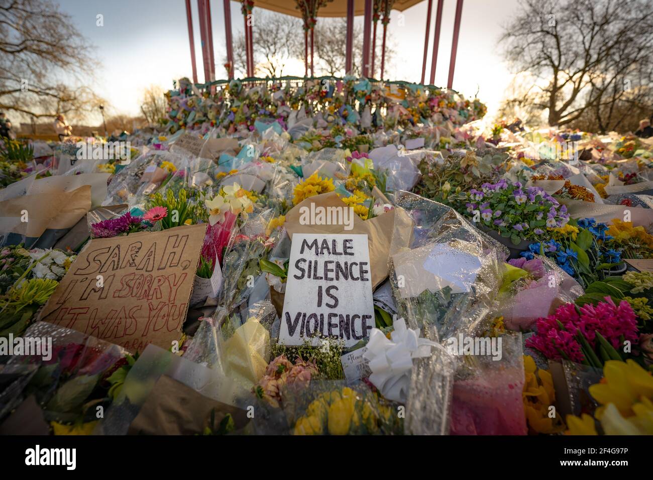 London, UK. 21st March, 2021. Death of Sarah Everard: Floral tributes continue at Clapham Common bandstand in memory of murdered 33-year-old marketing executive Sarah Everard who went missing on Wednesday 3rd March after leaving a friend's house near Clapham Common to walk home. Credit: Guy Corbishley/Alamy Live News Stock Photo