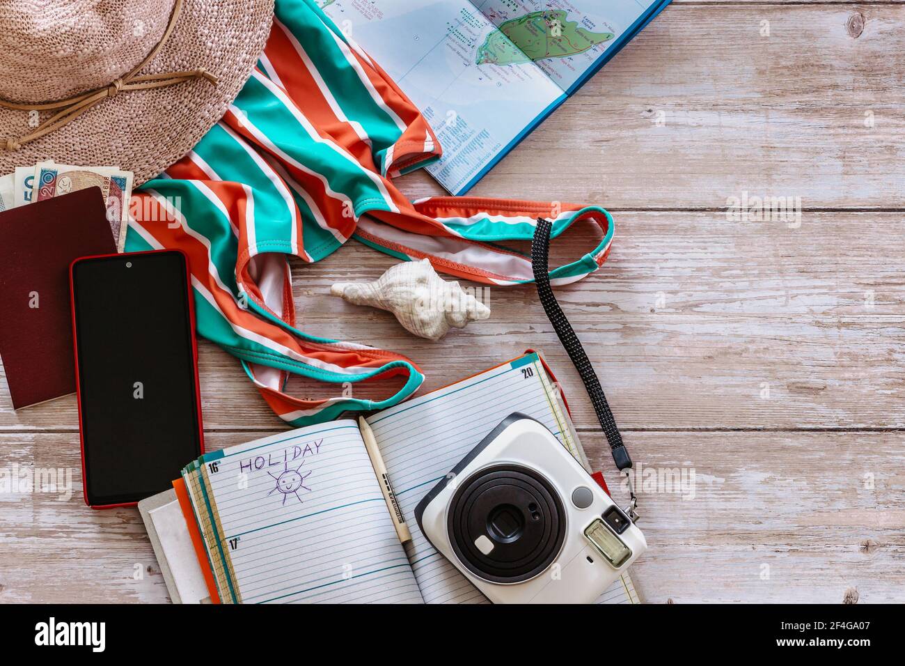 Travel concept banner flat lay.Items for summer vacation: passport,swimsuit,hat,money,Mexico map, camera,diary copy space.Top view holiday concept. Stock Photo
