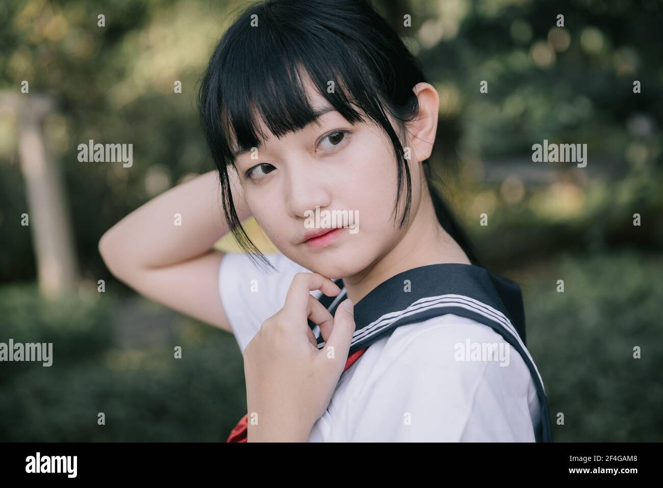 Portrait Of Asian Japanese School Girl Costume Looking At Park Outdoor