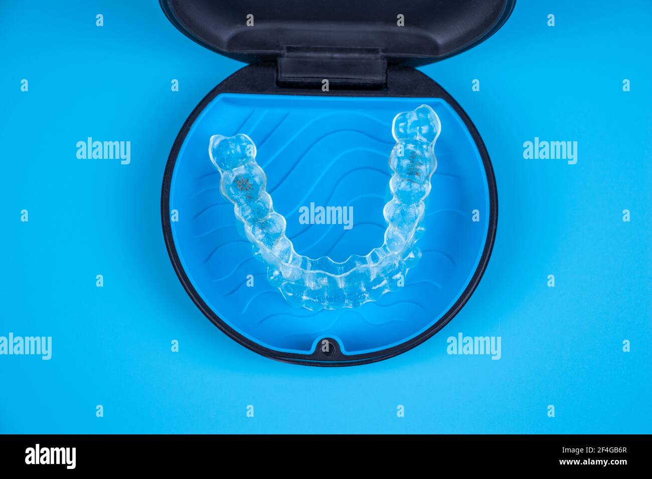 Invisalign transparent braces in a plastic case. Orthodontic invisible