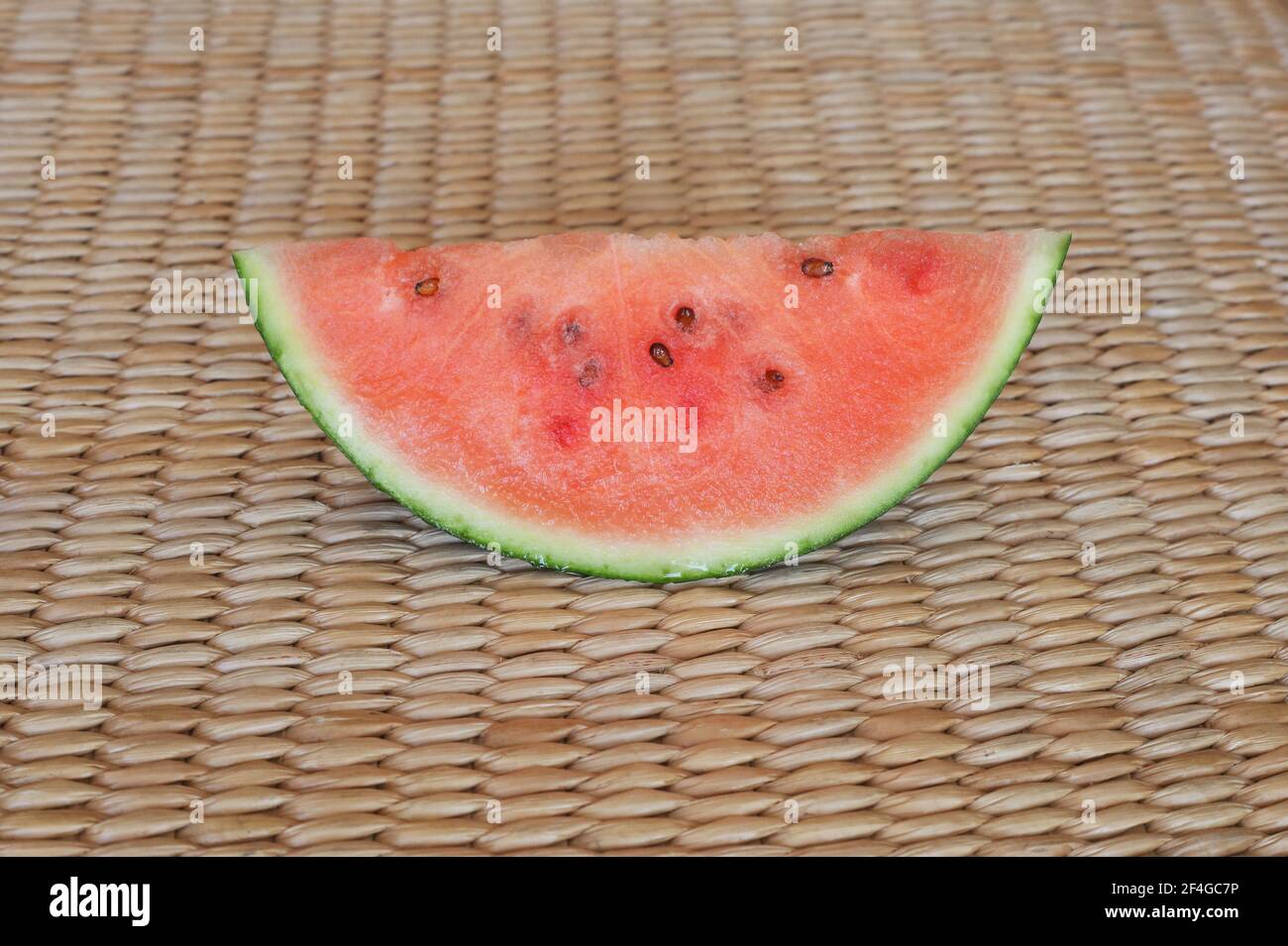 watermelon slice on the bamboo background Stock Photo