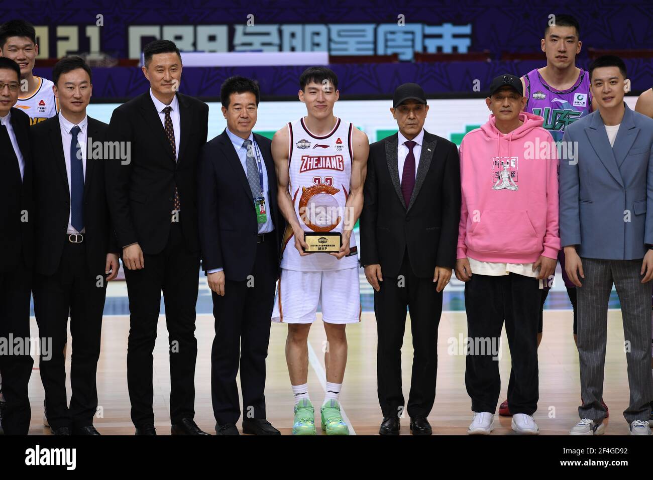 Qingdao, China's Shandong Province. 21st Mar, 2021. Wu Qian (C) of the South Team poses with the MVP trophy after the CBA All-Star Game at the 2020-2021 Chinese Basketball Association (CBA) league in Qingdao, east China's Shandong Province, March 21, 2021. Credit: Li Ziheng/Xinhua/Alamy Live News Stock Photo