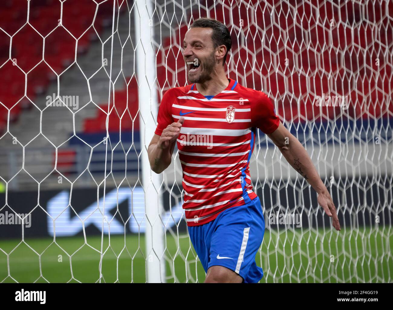 BUDAPEST, HUNGARY - MARCH 18: Roberto Soldado of Granada CF celebrates his goal during the UEFA Europa League Round of 16 Second Leg match between Molde and Granada at Puskas Arena on March 18, 2021 in Budapest, Hungary. Sporting stadiums around Europe remain under strict restrictions due to the Coronavirus Pandemic as Government social distancing laws prohibit fans inside venues resulting in games being played behind closed doors. Stock Photo