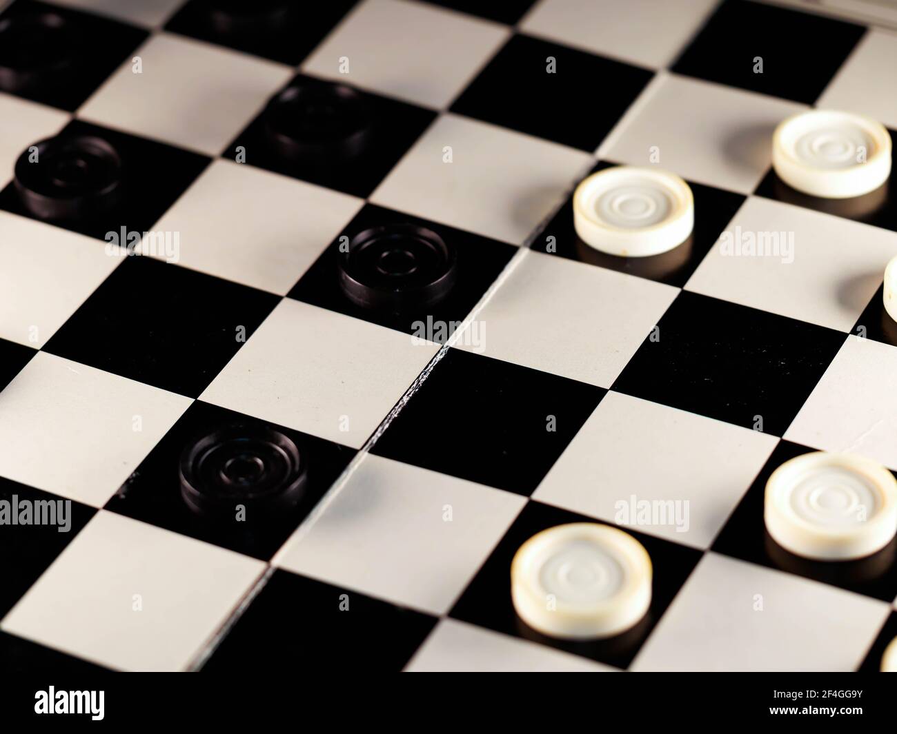 checkerboard with checkers. game concept.board game.hobby.checkers on playing field for a game Stock Photo