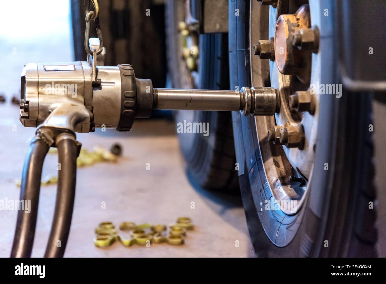 Pneumatic machine to tighten or loosen the lug nuts of a truck. Stock Photo