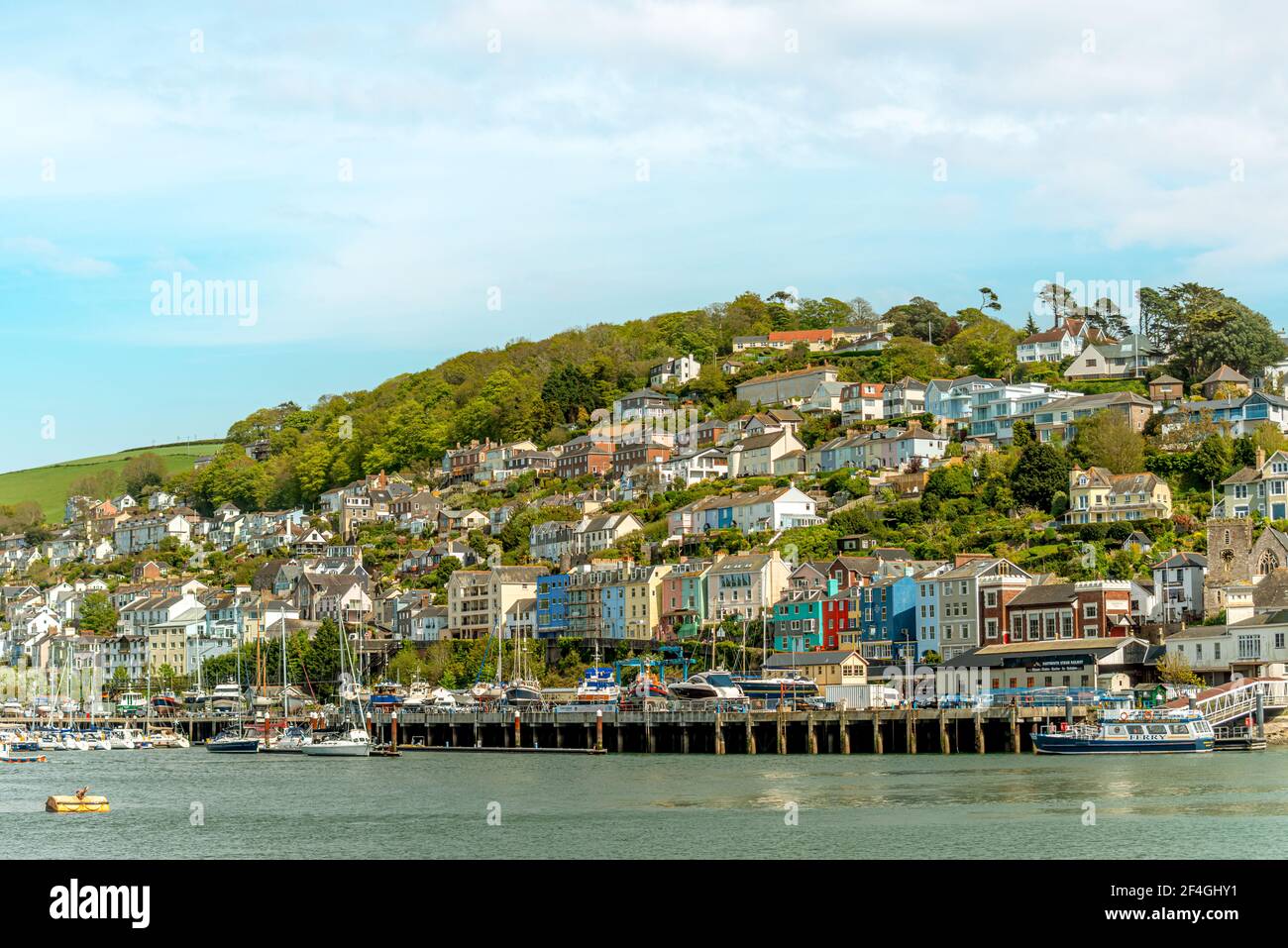 Colourful houses at the waterfront of Kingswear seen from Dartmouth, Devon, England, UK Stock Photo