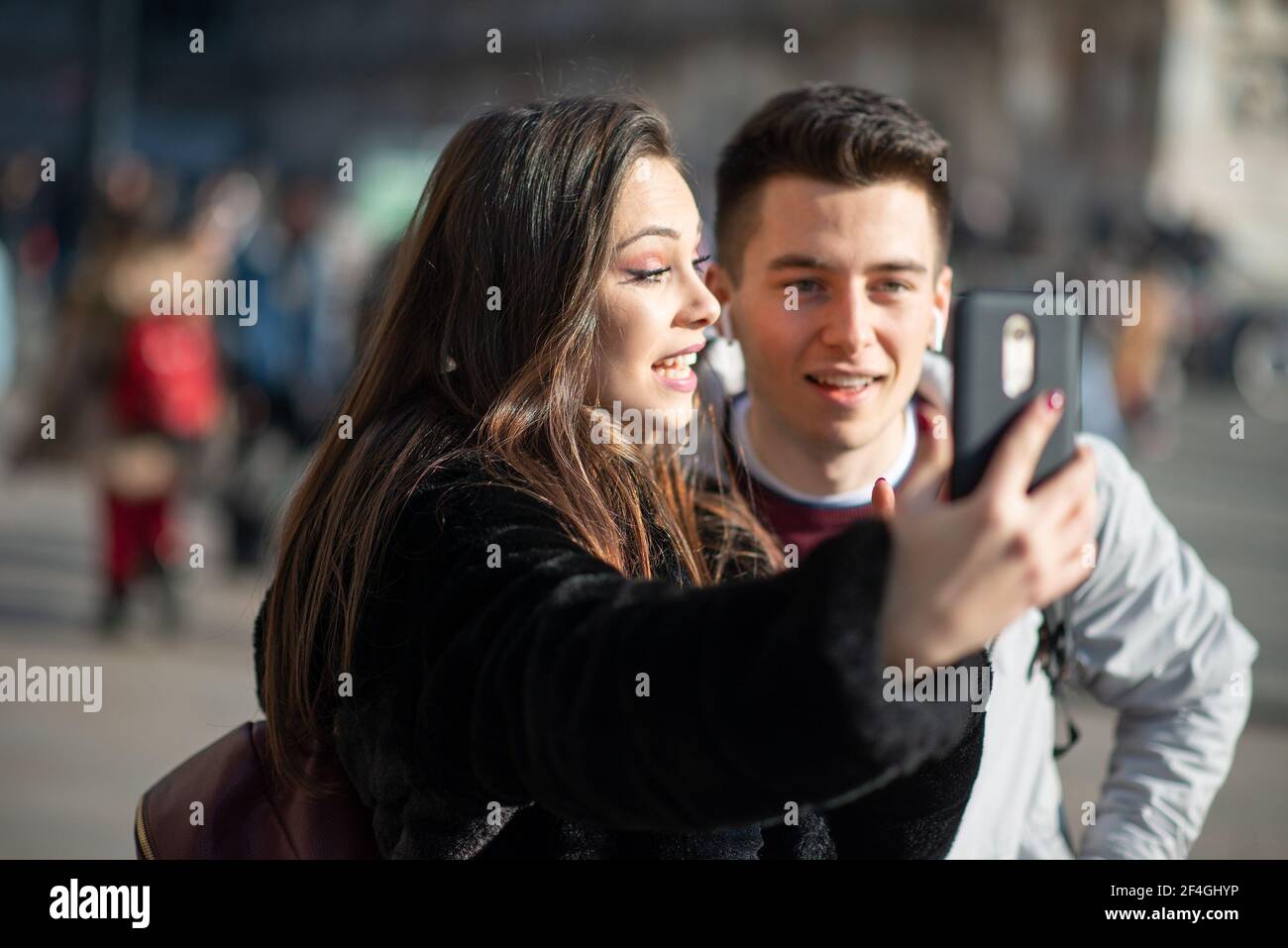 Couple of turists taking a selfie in an European city Stock Photo