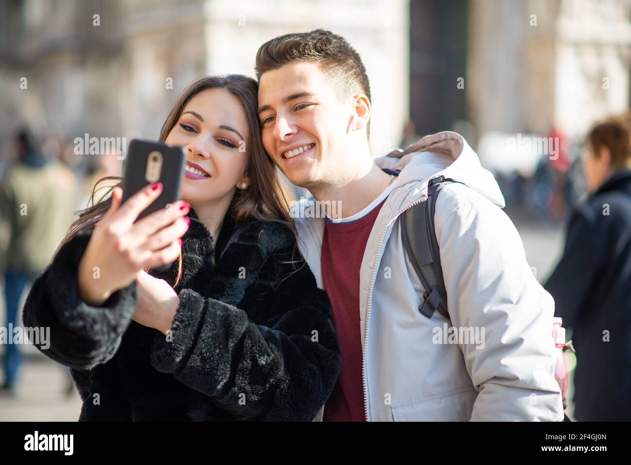 Couple of turists taking a selfie in an European city Stock Photo
