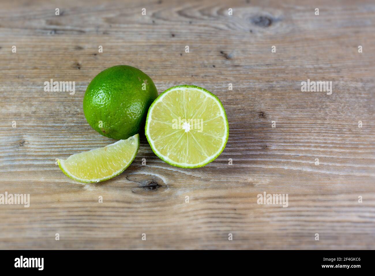 close up of lime on wooden background Stock Photo