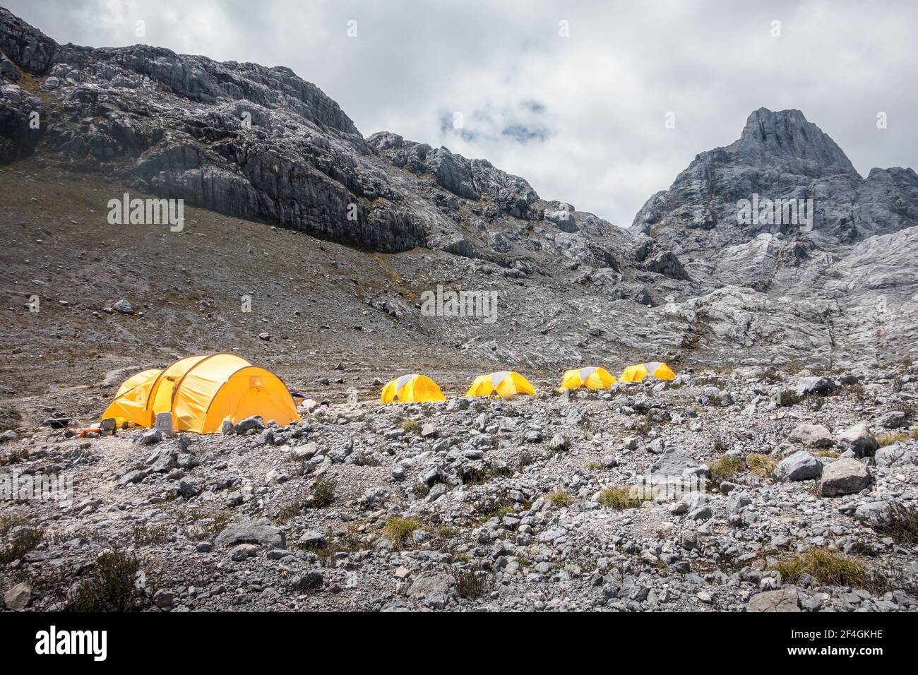 Camping tents in the Carstensz Pyramid (Puncak Jaya) high-altitude base camp during the mountaineering expedition to one of the Seven Summits Stock Photo