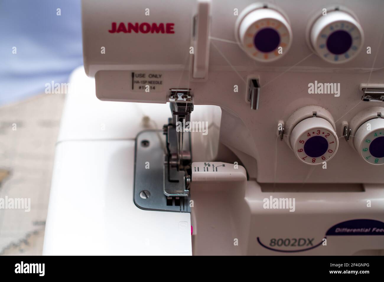 A close up of a Janome overlocker sewing machine with intentional selective  focus, shallow depth of fiedl and bokeh Stock Photo - Alamy