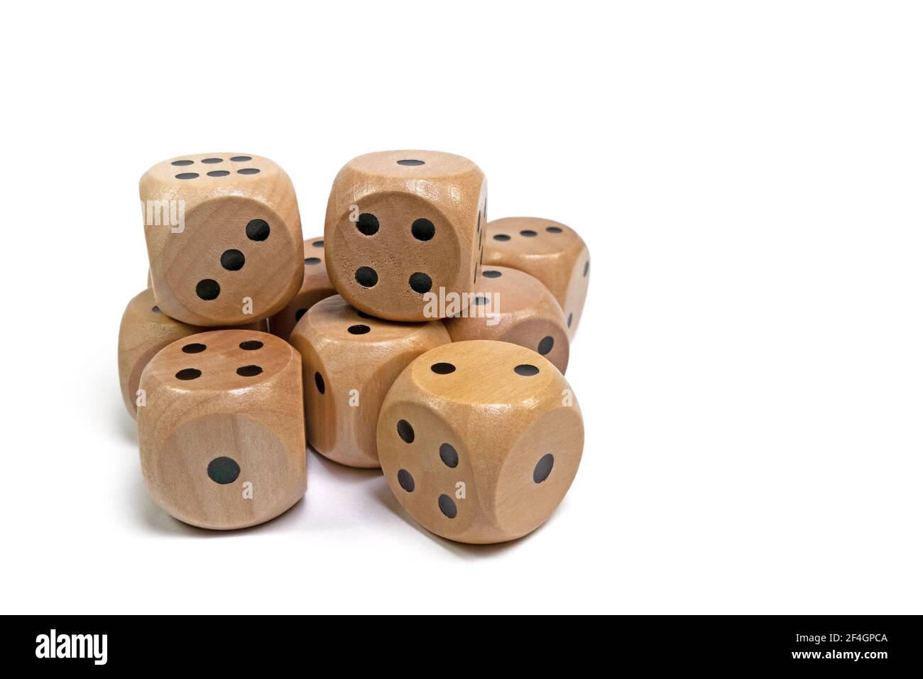 Wooden game dice against a white background Stock Photo