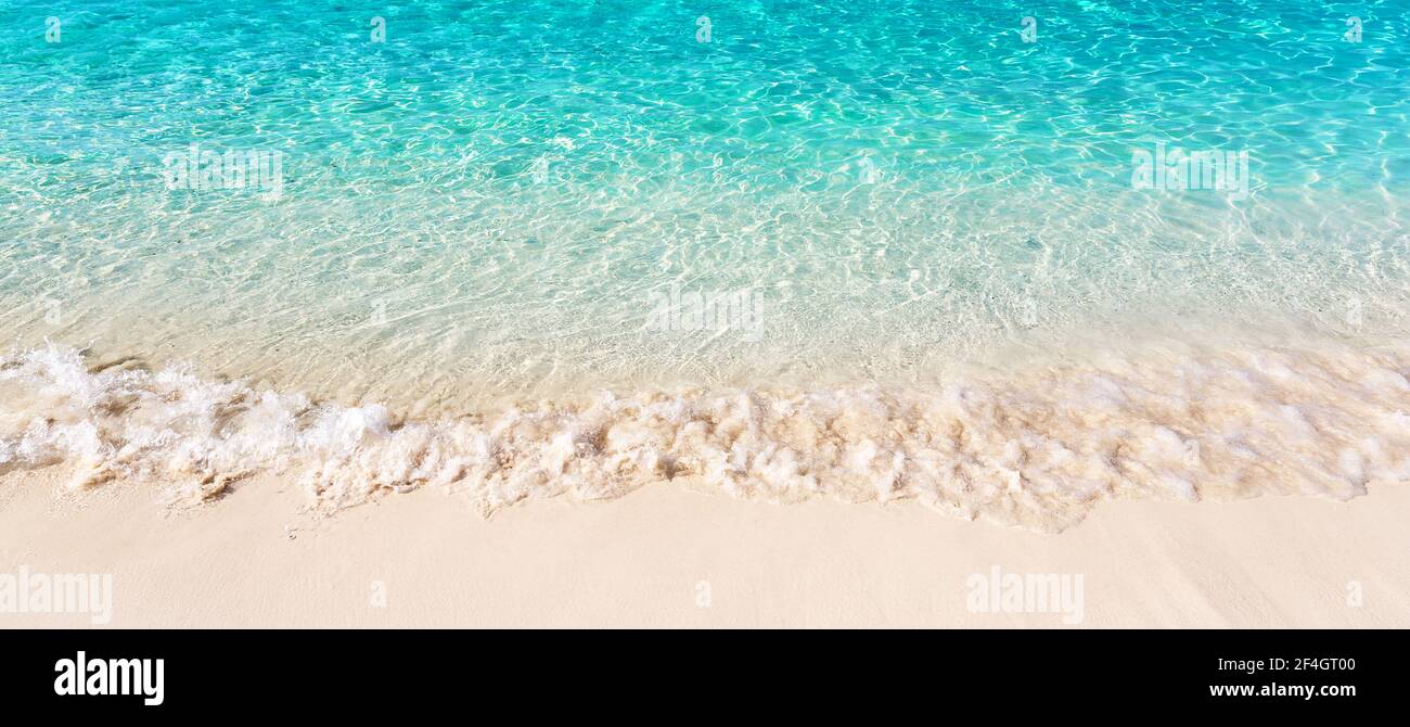 Panorama of wave of the sea on the sand beach in Punta Cana, Dominican Republic. Landscape of tropical summer. Summer beach vacation concept. Stock Photo