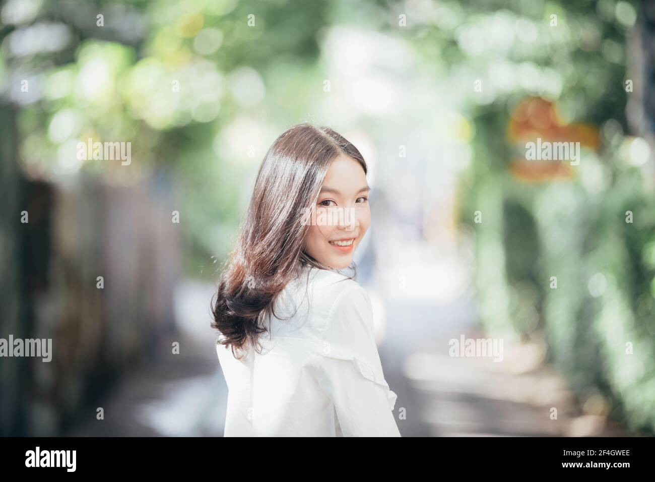 Portrait young woman thinking and looking modern style in outdoor urban ...